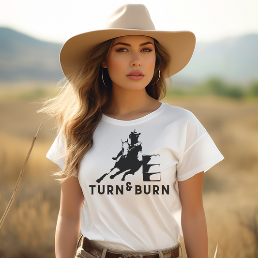 Rev up your rodeo style with our 'Turn and Burn' Barrel Racer T-shirt! Inspired by the adrenaline-fueled world of barrel racing, this tee captures the heart-pounding excitement of each tight turn and lightning-fast run. 